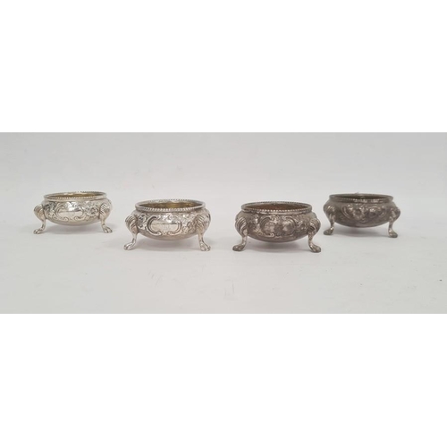 371A - Set of four Victorian silver salts, cauldron shaped, each floral embossed and on three paw feet, par... 