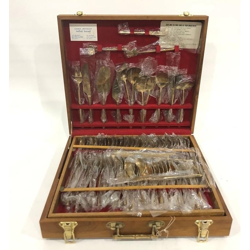 375 - Extensive Eastern brass service of table flatware in teak-effect case