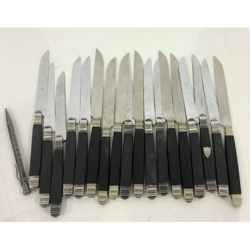 387 - Quantity of French Chastel ebony-handled knives with silver-coloured metal mounts, some with shield-... 