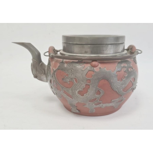 116 - Redware and white metal clad teapot with twin metal loop handle, dragon decorated