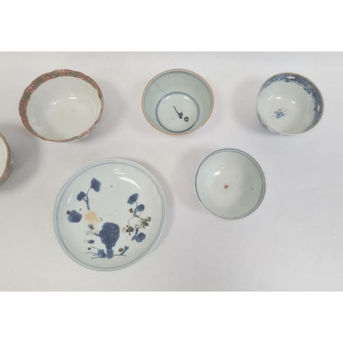 132 - Three Chinese porcelain tea bowls with blue landscape and plant decoration, similar saucer and a set... 