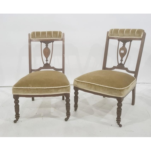 1345 - Pair of 19th century low chairs with mahogany inlaid frames, turned front legs to brown china castor... 