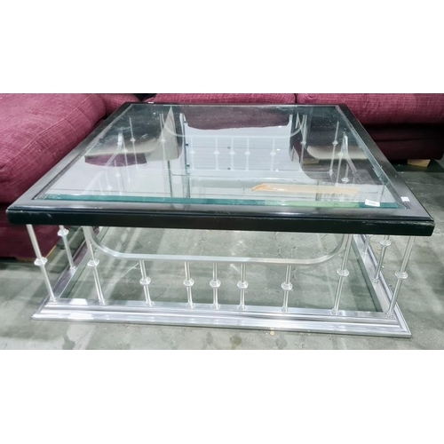 1361 - Square glass-topped coffee table on polished metal club fender-type base