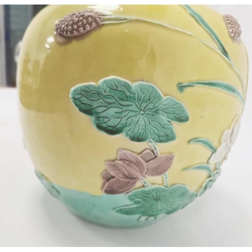 141 - Chinese Wang Bingrong ginger jar, decorated in relief with cranes and flowering lotus, on a yellow g... 