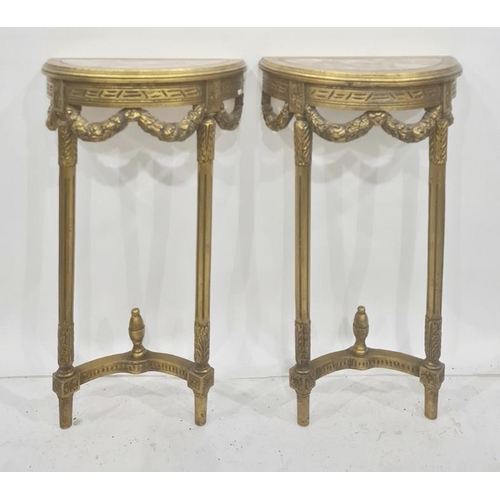 1417 - Pair of reproduction gilt wood and marble console tables, each of demi-lune design, decorated with f... 