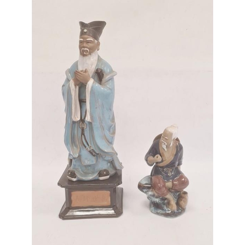 148 - Chinese tinted bisque and partly glazed figure of a sage in blue robes and on square ceramic plinth ... 