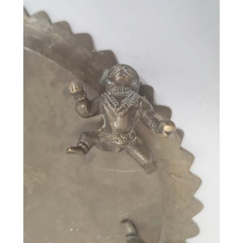 155 - Pair Indian brass shallow dishes, each oval and embossed with dancing figures, on crawling figure su... 