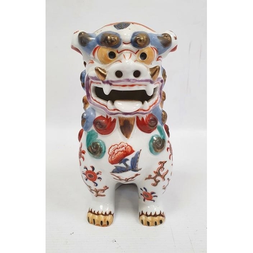 16 - Chinese turquoise glazed model Buddhist lion,18cm high, two various bisque and partly glazed figures... 