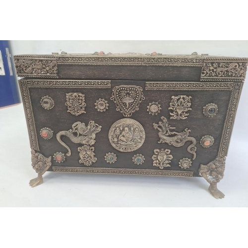 163 - Eastern wooden casket of rectangular form, the body and hinged cover decorated with applied metal mo... 