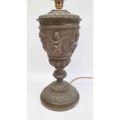 194 - Table lamp with 19th century oil lamp body, embossed cherub decoration, 35cm high