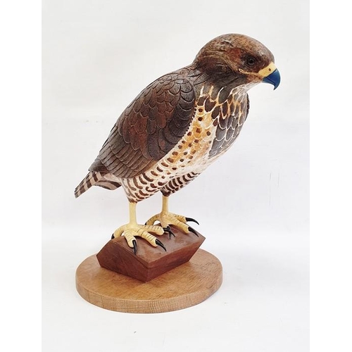 195 - Carved wood figure of bird of prey, marked verso 'B2000 1/1', 42cm high