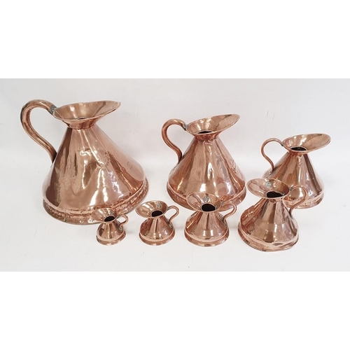 206 - Set of seven antique graduated copper conical jug measures