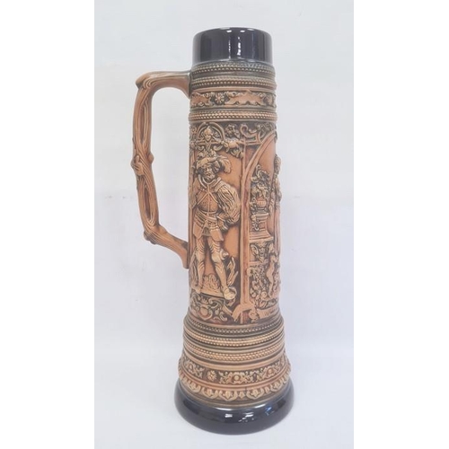 21 - German Gerzit extra large pottery stein, embossed medieval figures and having blue glazed borders, c... 