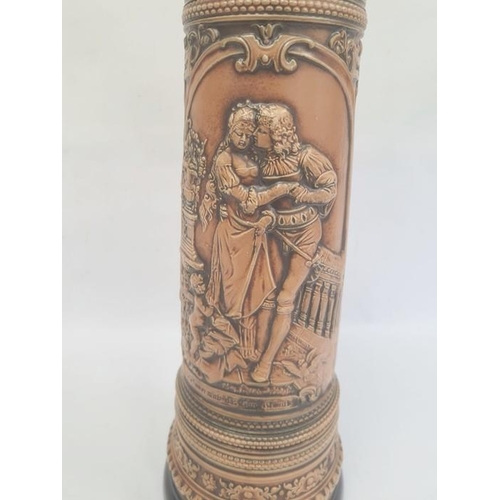 21 - German Gerzit extra large pottery stein, embossed medieval figures and having blue glazed borders, c... 