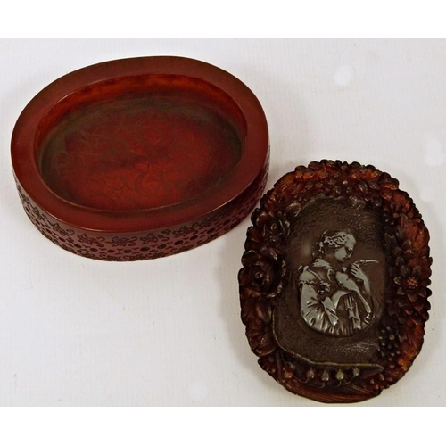 223 - Amber-coloured box of oval form, signed to base 'J Guipt of Paris', with carved decoration to the li... 