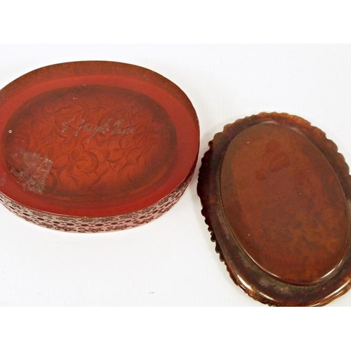 223 - Amber-coloured box of oval form, signed to base 'J Guipt of Paris', with carved decoration to the li... 