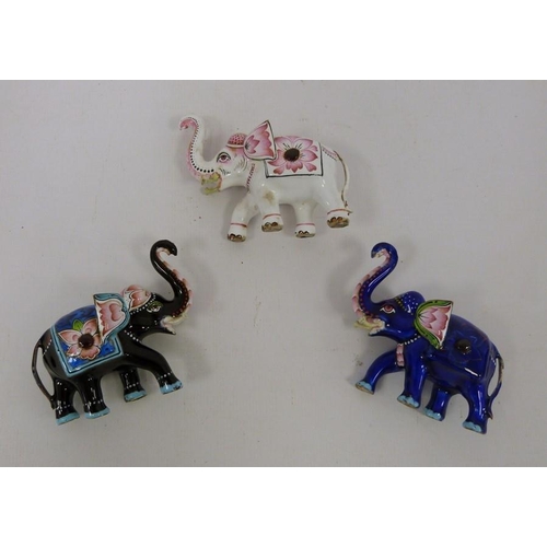 228 - Three 20th century enamel models of elephants, each 6cm high (3)