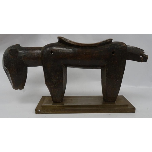 252B - 20th century Senufo carved wooden stool in the form of a dog, 34cm high, on rectangular metal base (... 