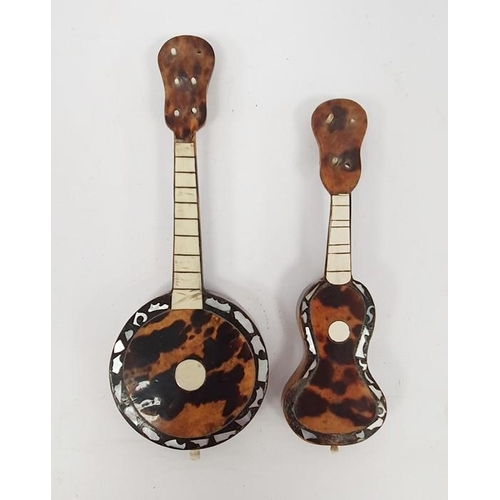 268 - A miniature tortoiseshell and mother of pearl inlaid banjo and guitar (2)