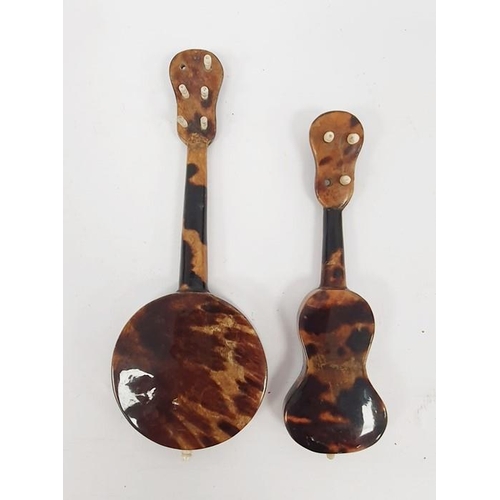 268 - A miniature tortoiseshell and mother of pearl inlaid banjo and guitar (2)