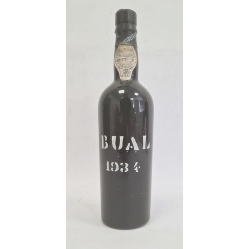 283 - Bottle of Madeira wine, the bottle marked Bual 1934 with label to neck marked 'Selo De Garantia Made... 