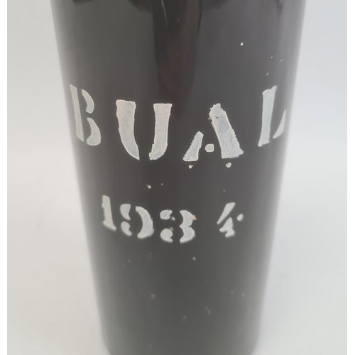 283 - Bottle of Madeira wine, the bottle marked Bual 1934 with label to neck marked 'Selo De Garantia Made... 