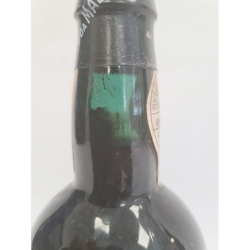 283 - Bottle of Madeira wine, the bottle marked Bual 1934 with label to neck marked 'Selo De Garantia Made... 