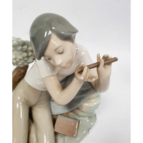 3 - Lladro porcelain figure of boy with flute, 20cm high and another of girl seated with lamb (2)