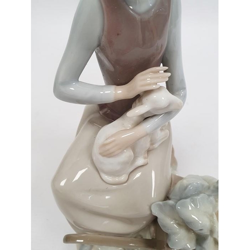 3 - Lladro porcelain figure of boy with flute, 20cm high and another of girl seated with lamb (2)