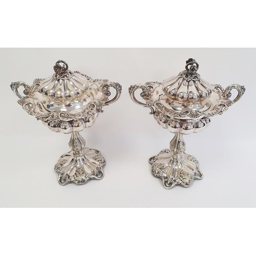 316 - Pair of silver plated two handled lidded pedestal bowls, flower finials, scroll decorated, semi gadr... 