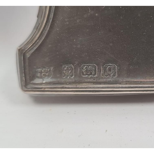 404 - An early 20th century silver mounted photograph frame, Birmingham 1913, a 1930s circular silver moun... 