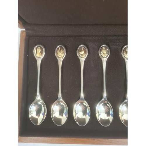 431 - Set of 12 silver spoons from the RSPB Spoon Collection, each spoon with a silver-gilt finial depicti... 