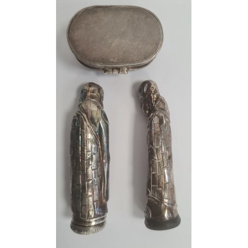 451 - Two white metal figural sifters, modelled as robed Chinese figures, their foreheads pierced, 8cm hig... 