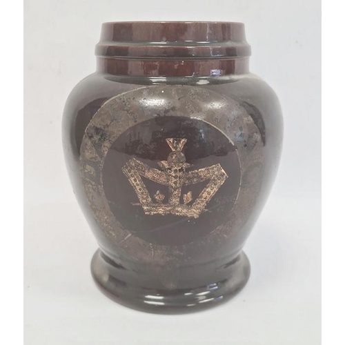 51 - Old treacle glazed storage pot, squat baluster shaped with indistinct wording and crown, 23cm high