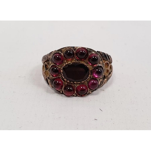 568 - Probably Victorian garnet dress ring, unmarked, yellow metal set