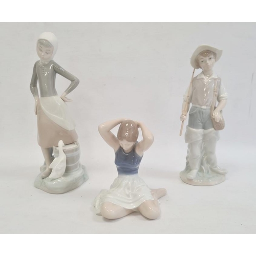 59 - Lladro porcelain figure of a girl with duck, Lladro porcelain figure of fishing boy and Royal Copenh... 