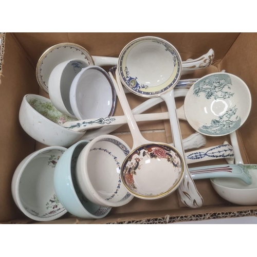 76 - Quantity of Victorian and later pottery soup ladles, variously decorated (1 box)