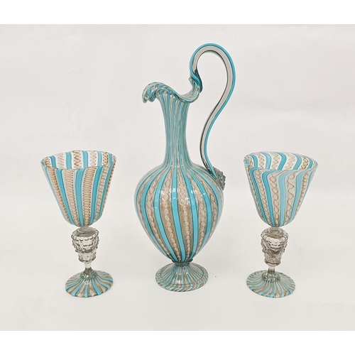 85 - Pair of Venetian latticino glass goblets with latticino bands above the stem, with lion and garland ... 