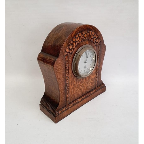 1001 - Mid 20th century Smiths oak timepiece, the arched case stylised flowerhead carved on plinth base, 25... 