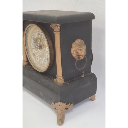 1002 - Mantel clock with arabic numerals, painted black body and gold painted highlights, chiming mechanism... 