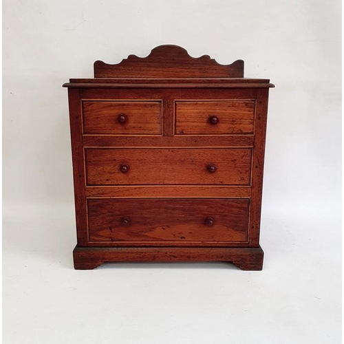 1012 - Stained wood miniature chest of drawers with raised shaped back, of two short and two long drawers, ... 