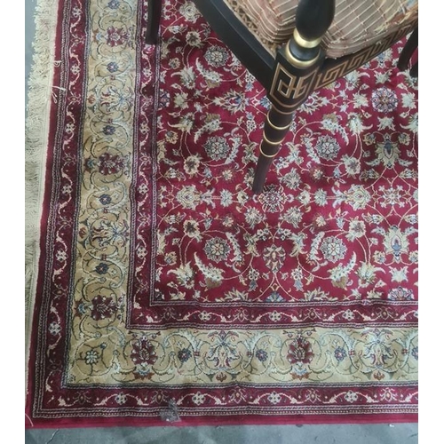 1034 - Red ground Kashmiri rug, allover floral decoration with gold border, 240 x 160cm