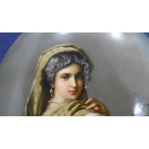 112 - Late 19th century Berlin KPM porcelain plaque, oval and painted with half-length figure of a young w... 