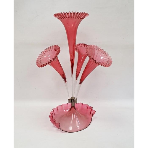 123 - Cranberry and clear glass epergne with central flared trumpet vase, having surround of three smaller... 