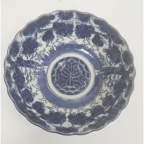 153 - Chinese blue and white plate, the centre decorated with a pagoda on a lake within a border of insect... 