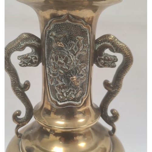 156 - Asian brass two-handled vase, embossed bird and plant decoration and having dragon handles, 38cm hig... 