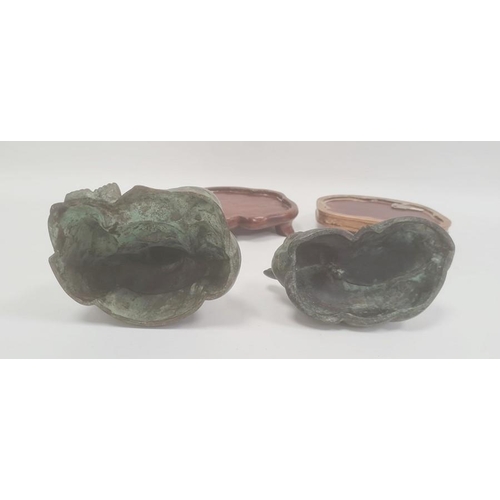 162 - Bronze effect seated buddha on stand and similar lying cat, green patinated finish