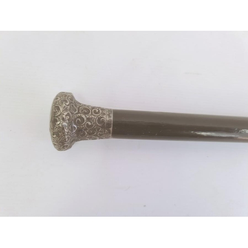 276 - Silver-mounted ebonised walking cane with scroll decoration, London assay