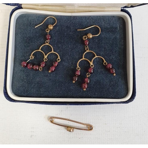 285 - Pair of gold-coloured drop earrings hung with garnet beads and a bar-brooch set with green paste dou... 