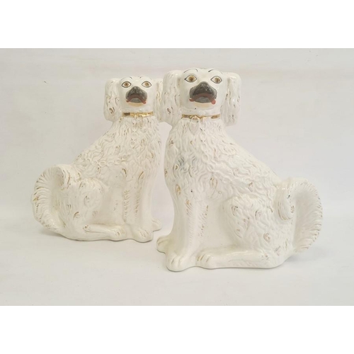 30 - Pair of Staffordshire pottery models of spaniels, circa 1880, modelled in opposing directions, their... 